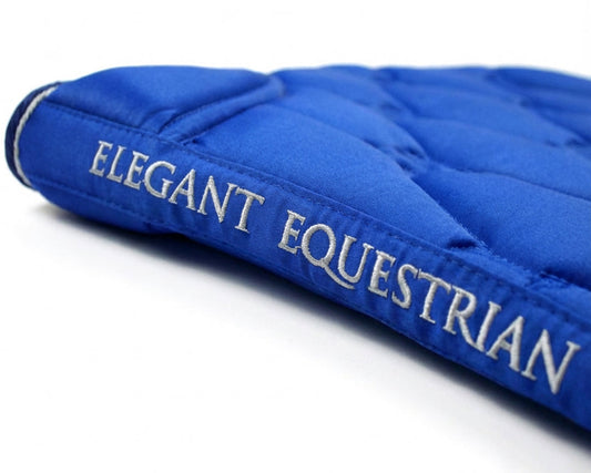 Blue equestrian saddle pad with 'Elegant Equestrian' branding on a white background